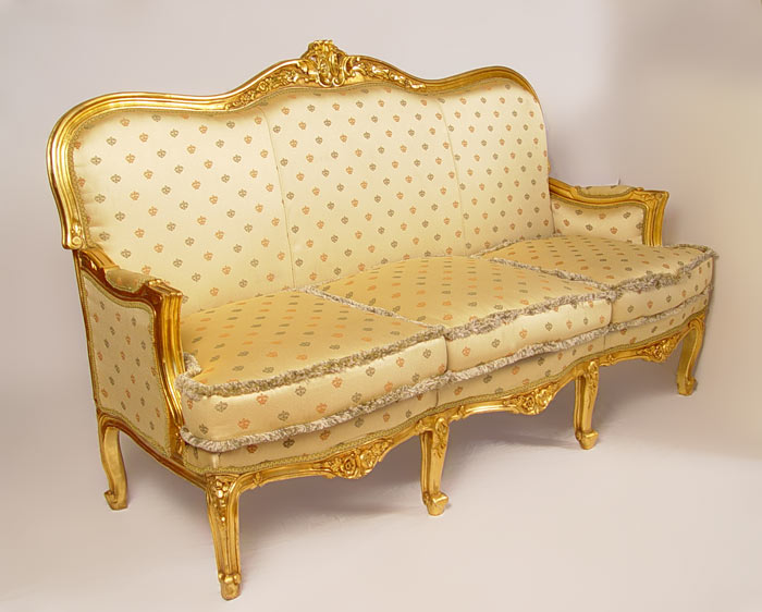 Appraisal: FRENCH STYLE CARVED AND GILT WOOD SOFA Three cushion seat