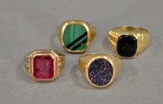 Appraisal: Four K gold men's rings with stones grams Four K