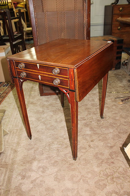 Appraisal: A GEORGE III RECTANGULAR MAHOGANY PEMBROKE TABLE the top with