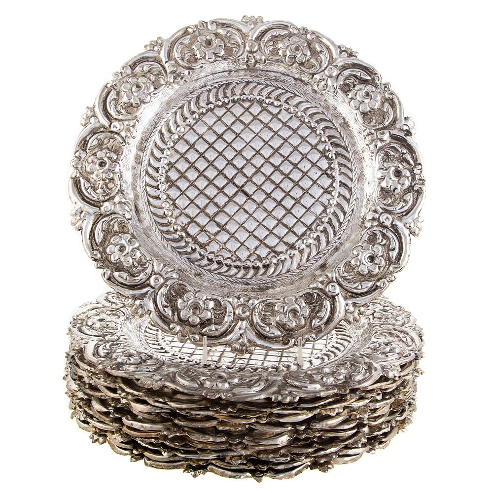 Appraisal: Twelve Baroque Style Silver Plated Chargers Each with floral and