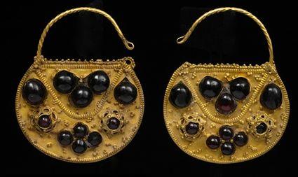 Appraisal: PAIR OF ISLAMIC GOLD AND GARNET LUNETTE EARRINGS in Provenance