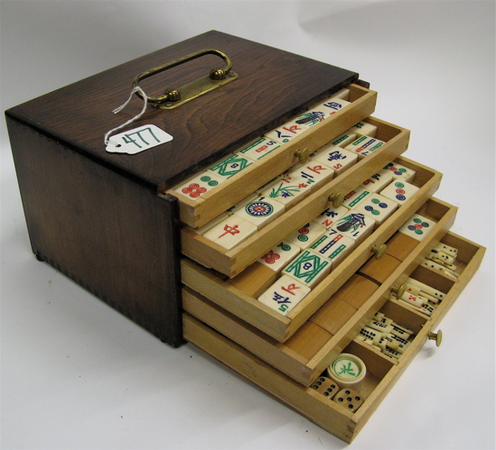 Appraisal: CHINESE HARDWOOD CASED MAHJONG SET having five drawers of game