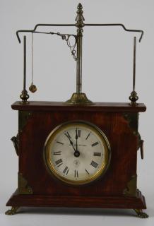 Appraisal: pat Jerome flying pendulum clock running condition ht pat Jerome