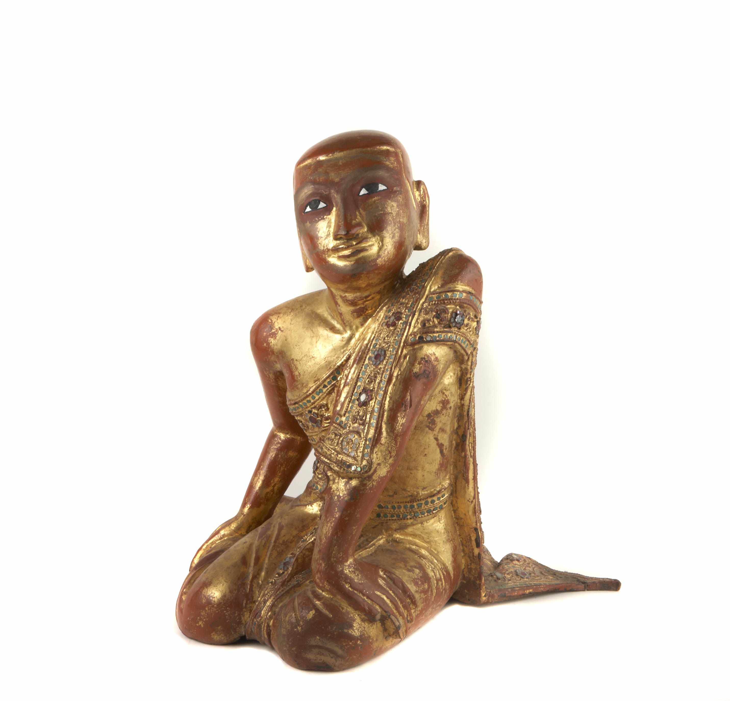 Appraisal: A Thai or Burmese red and gold lacquered wood figure