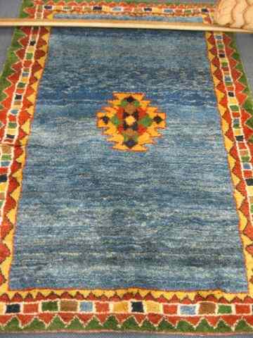 Appraisal: Gaby Handmade Rug geometric center border blue field thick pile