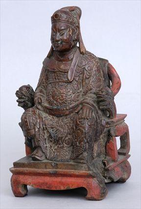 Appraisal: CHINESE CARVED WOOD FIGURE OF A SEATED DIGNITARY Seated wearing