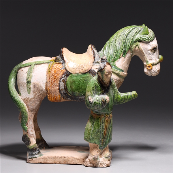 Appraisal: Chinese Ming dynasty partial glazed ceramic horse with standing attendant