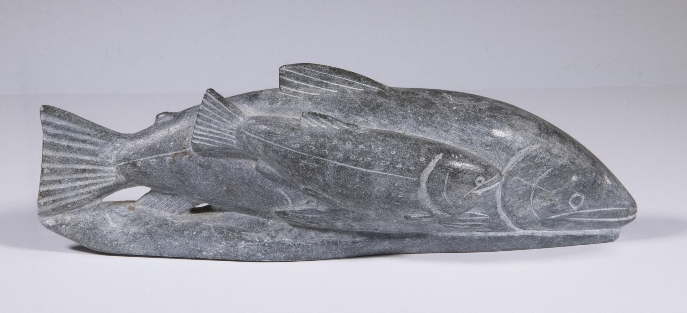 Appraisal: PETEROSIE QARPIK PANGNIRTUNG NUNAVUT Fish and Young grey soapstone x