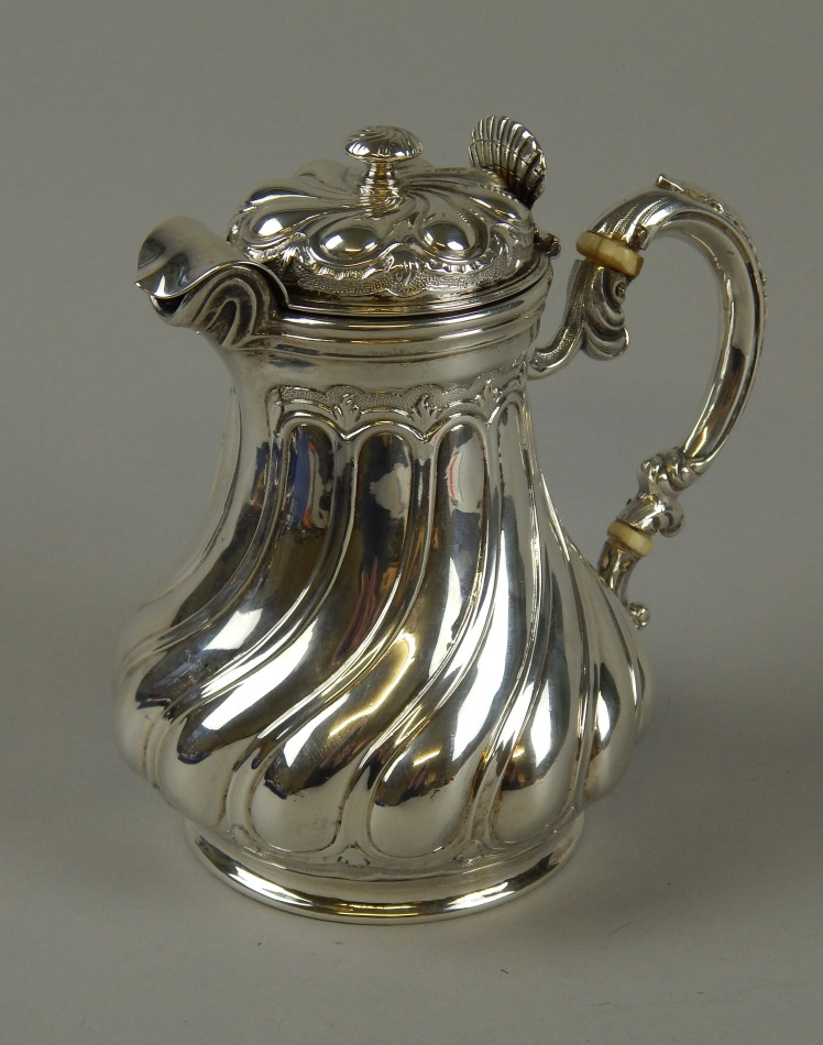 Appraisal: A thC French silver lidded jug with a wrythen baluster