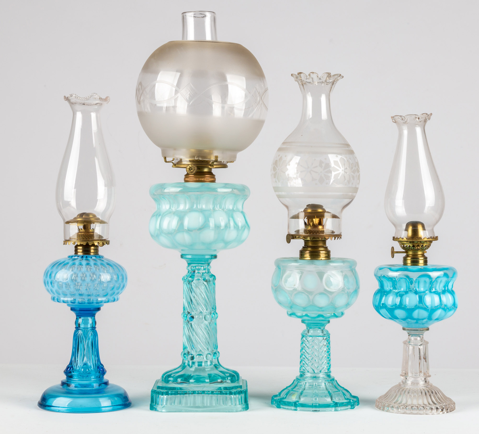 Appraisal: COIN SPOT DOT OIL LAMPS circa period burners and shades