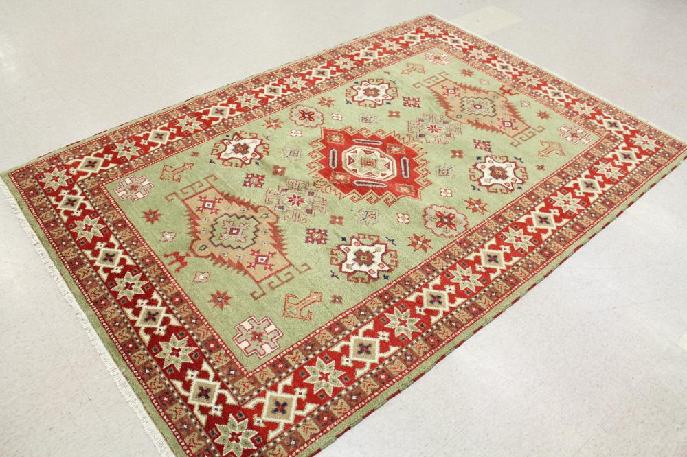 Appraisal: HAND KNOTTED ORIENTAL CARPET Indo-Persian tribal having three geometric medallions