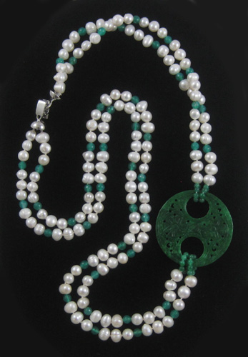 Appraisal: JADE AND PEARL DOUBLE STRAND NECKLACE measuring inches in length