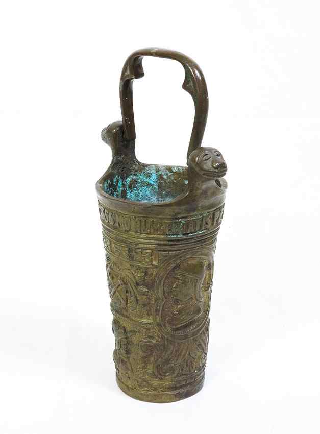 Appraisal: PORTUGUESE BRONZE TUMBLER Tumbler with bas relief figural plaques and