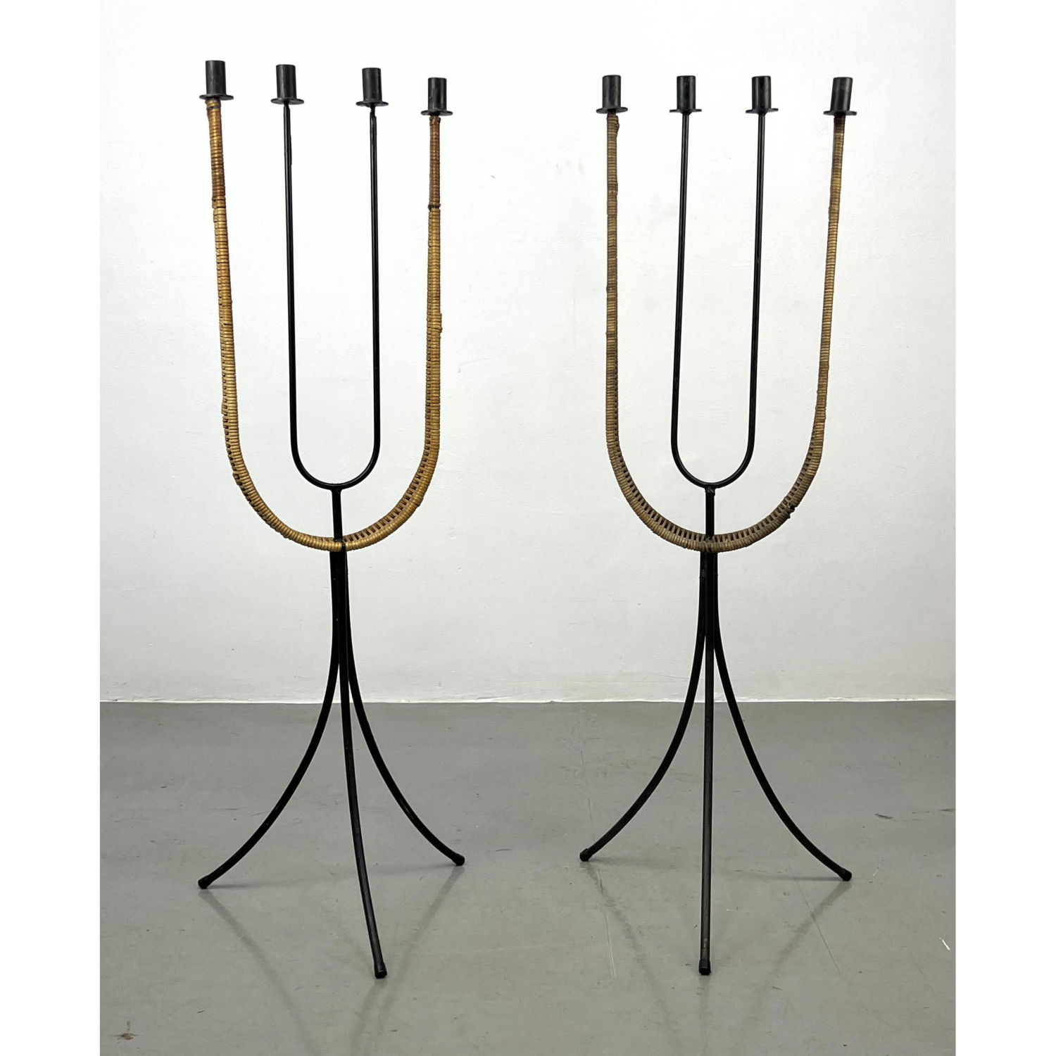 Appraisal: Pair of Arthur Umanoff Iron and Wicker Floor Candelabrum Candle