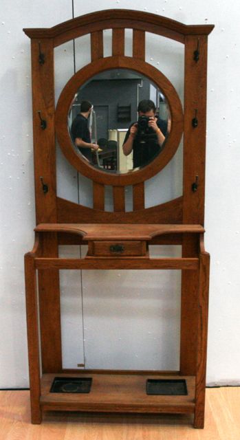 Appraisal: An arts and crafts American oak hallstand with central circular