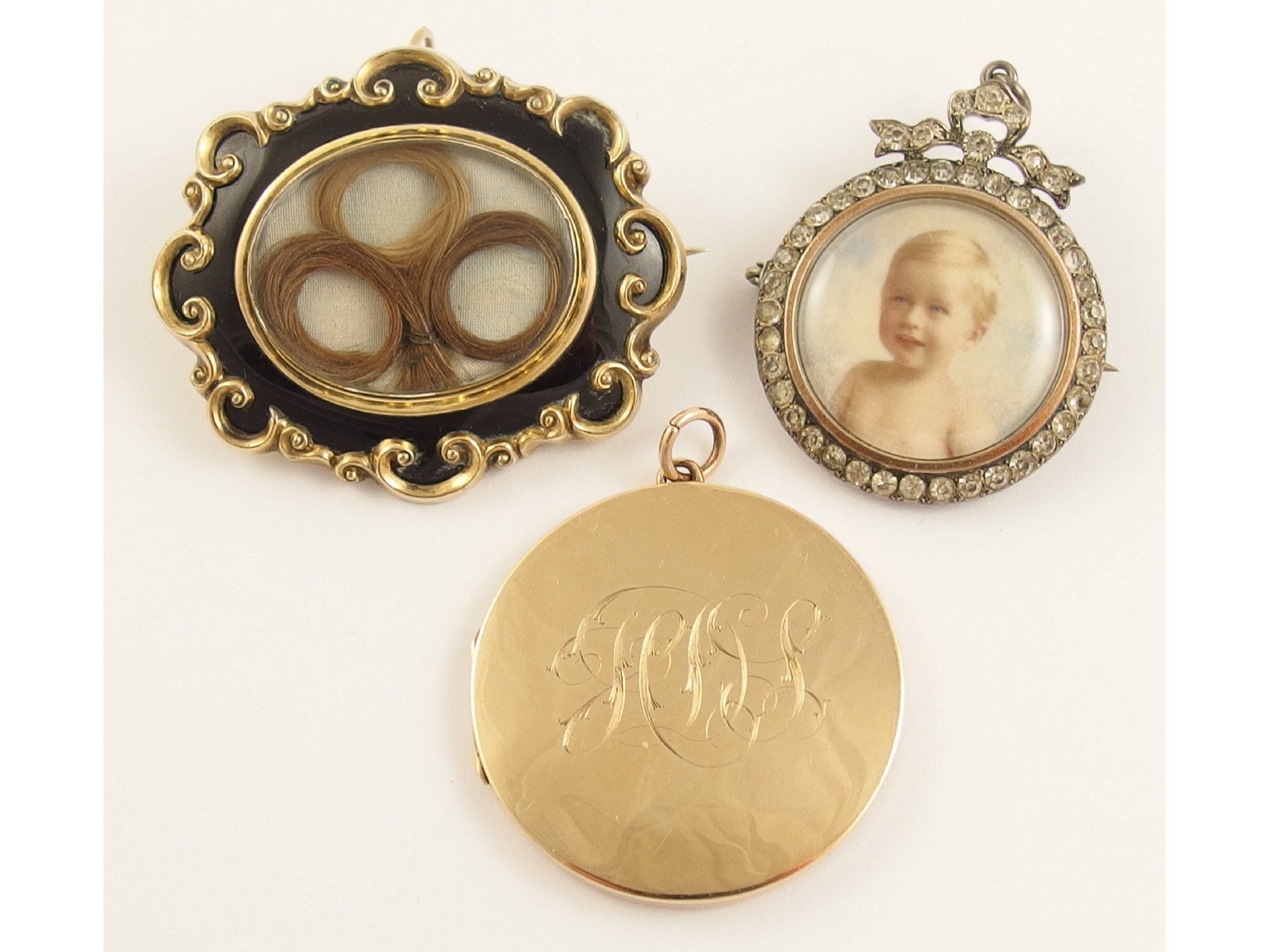 Appraisal: Two mourning jewels and a locketa Victorian yellow metal and