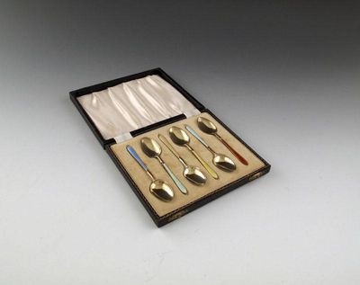 Appraisal: A set of six silver-gilt and poly-chrome enamel coffee spoons