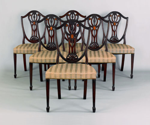 Appraisal: Set of six George III carved mahogany shieldback dining chairs