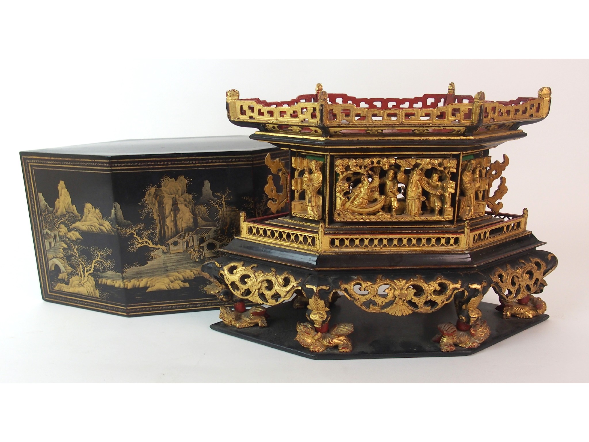 Appraisal: A Vietnamese black and gold lacquered cake boxthe hexagonal cover