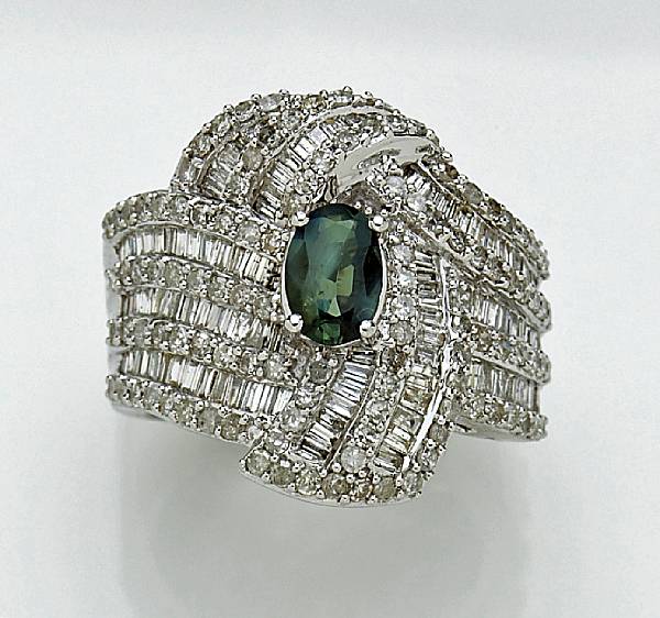 Appraisal: An alexandrite and diamond ring centering an oval-shaped alexandrite measuring