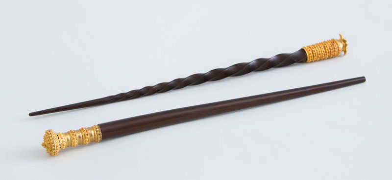 Appraisal: TWO GOLD-MOUNTED EBONY HAIR PINS POSSIBLY GOLD COAST Unmarked the