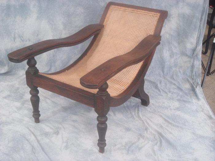 Appraisal: Pair of caned mahogany plantation chairs th c l x