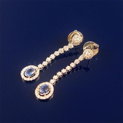 Appraisal: A pair of diamond and sapphire drop earrings the oval