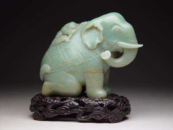 Appraisal: CARVED JADE ELEPHANT Realistically carved Chinese jade model of an