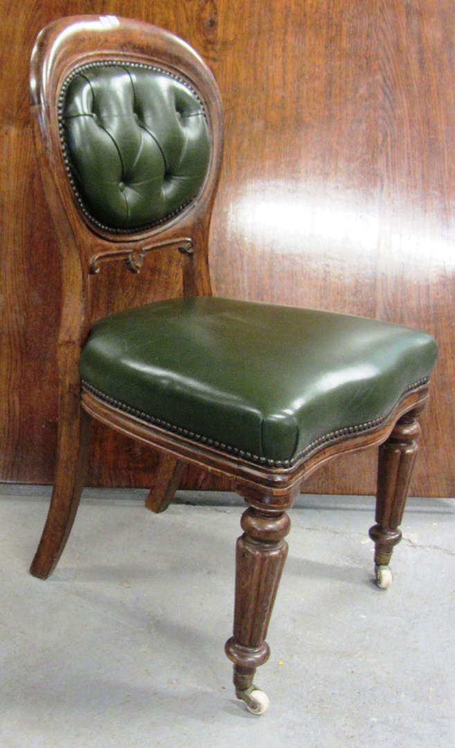 Appraisal: A set of eight Victorian oak and green leathered upholstered