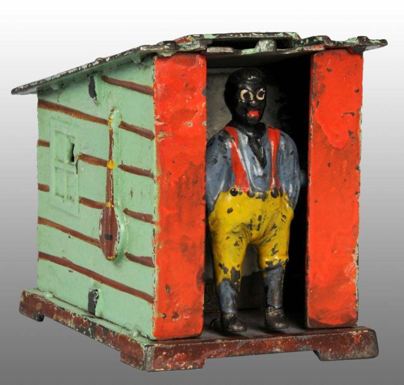 Appraisal: Cast Iron Cabin Mechanical Bank Description Manufactured by J E