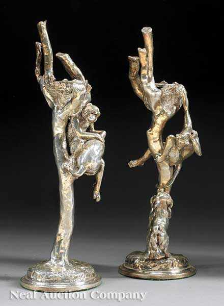 Appraisal: A Pair of Silverplate Figural Candlesticks with monkeys perched in