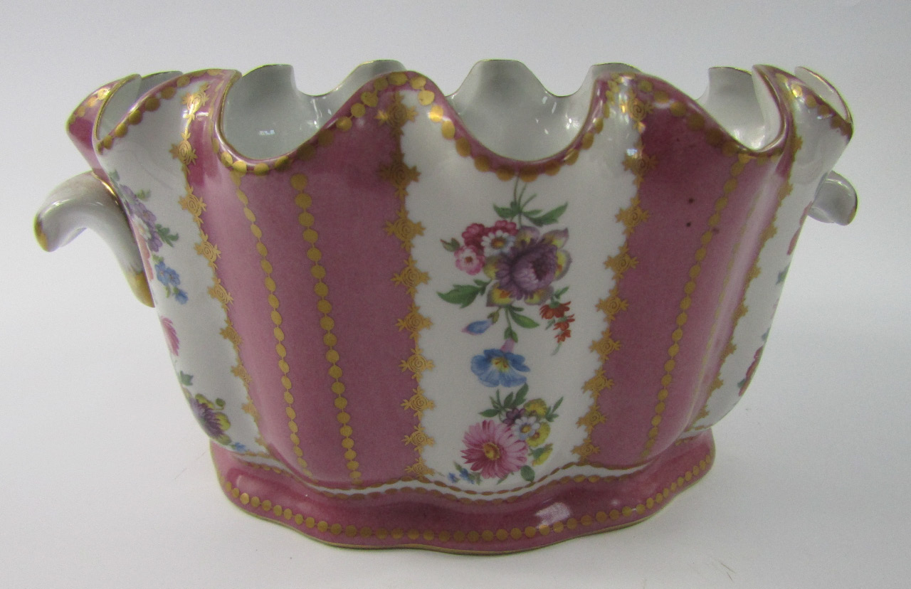 Appraisal: A Porcelaine Royale fluted twin handle cache-pot decorated with flowers