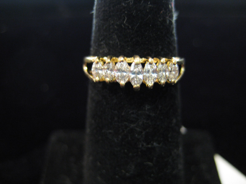 Appraisal: MARQUISE DIAMOND BAND k yellow gold single row wedding ring