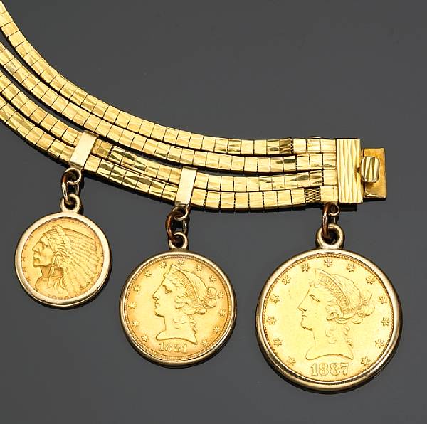 Appraisal: A gold coin bracelet suspending an US coin an US