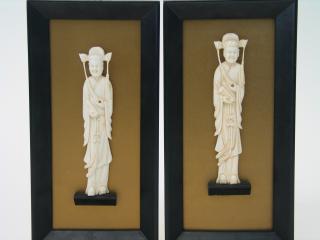 Appraisal: Pair of Chinese Wall Panel with Carved Figurines Pair of