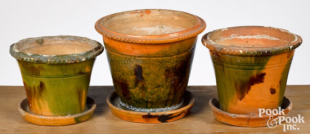 Appraisal: Three Pennsylvania redware flowerpots th c Three Pennsylvania redware flowerpots