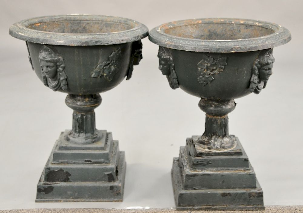 Appraisal: Victorian iron urns with face one small chip in base