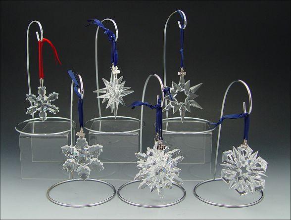 Appraisal: SWAROVSKI CRYSTAL CHRISTMAS ORNAMENTS Star and Snowflake shapes - -