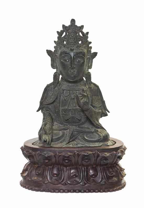 Appraisal: A Bronze Figure of a Buddhist Deity the figure wearing