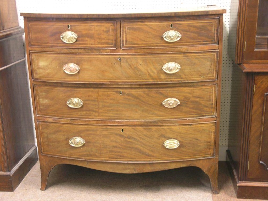 Appraisal: An early th century bow fronted mahogany chest of drawers