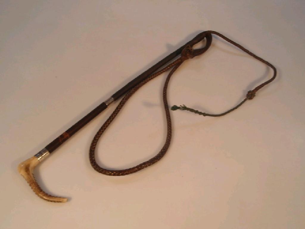 Appraisal: An early thC huntsman's whip with a polished horn handle