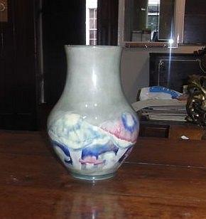 Appraisal: A MOORCROFT CLAREMONT PATTERN BALUSTER VASE with toadstool decoration in