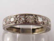 Appraisal: A French hallmarked carat white gold stone diamond half hoop