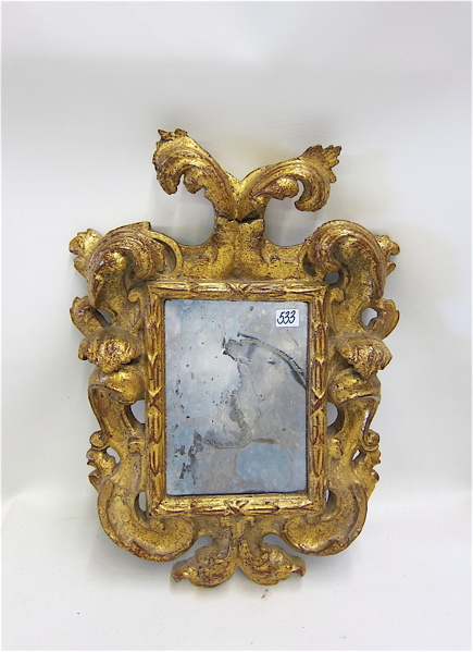 Appraisal: GILT FRAMED WALL MIRROR with molded gilt frame heraldic shield