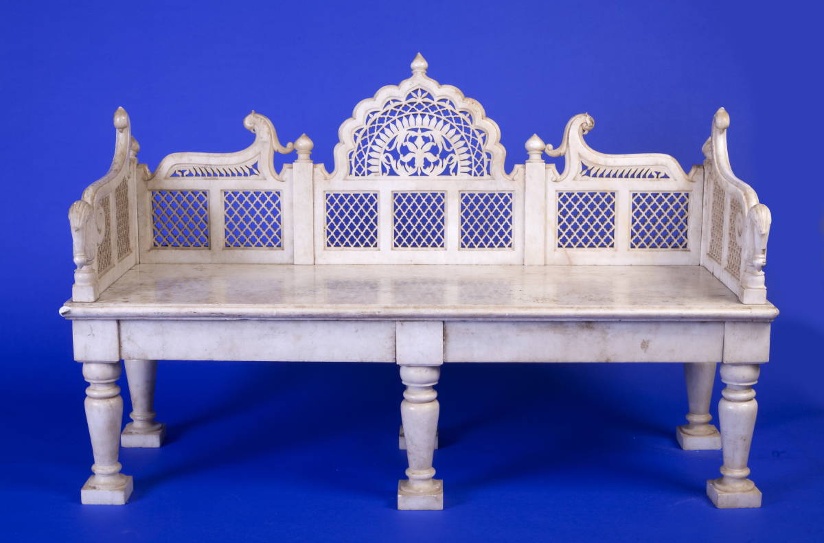 Appraisal: INDIAN CARVED WHITE MARBLE BENCH The scalloped arched back and