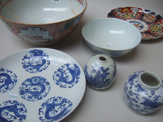 Appraisal: A group of Oriental ceramics comprising a Mandarin palette punchbowl