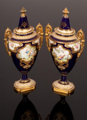 Appraisal: A pair of Royal Crown Derby vases and covers decorated