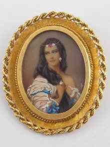 Appraisal: An oval miniature portrait of a lady set in carat