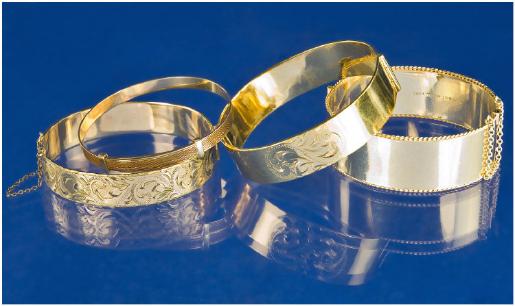 Appraisal: Four Metal Core Carat Gold Bangles