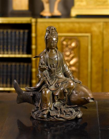 Appraisal: Japanese patinated bronze kannon on carp figureH in